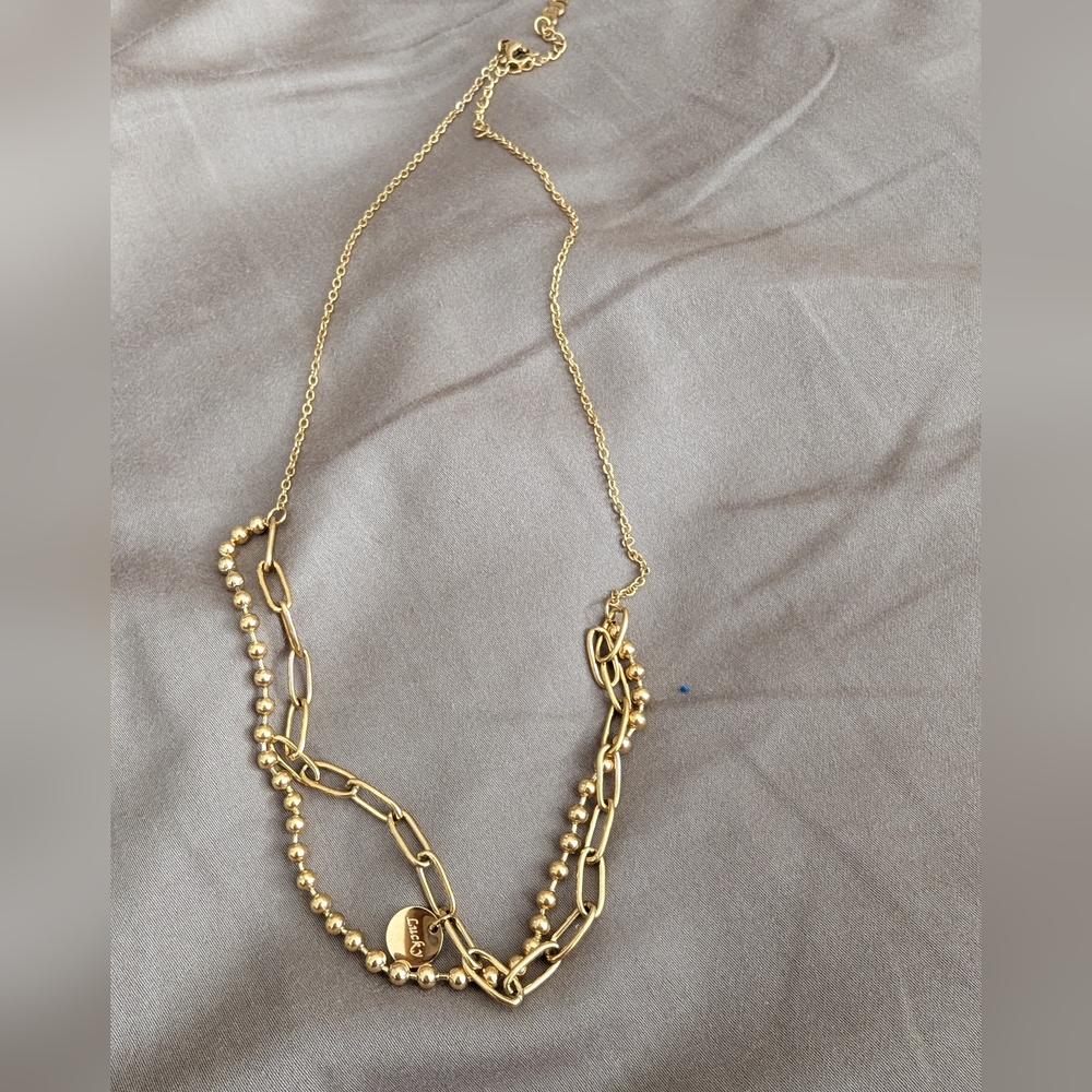 Layered Gold Plated Necklace With Word Lucky on One Charm